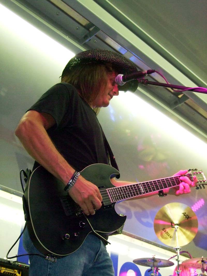 photo of man playing guitar